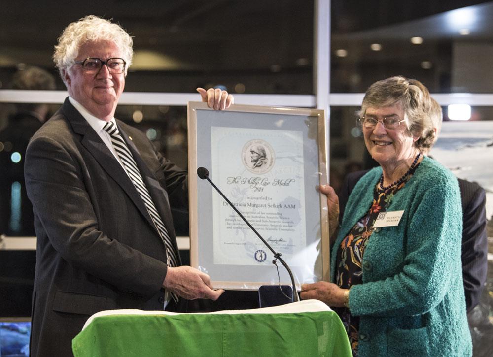 2018 Macquarie Island 70th Anniversary Celebration Dr Pat Selkirk AAM receiving the Phillip Law Medal from the Hon. Justice Alan Blow AO © D. Parer & E.Parer-Cook