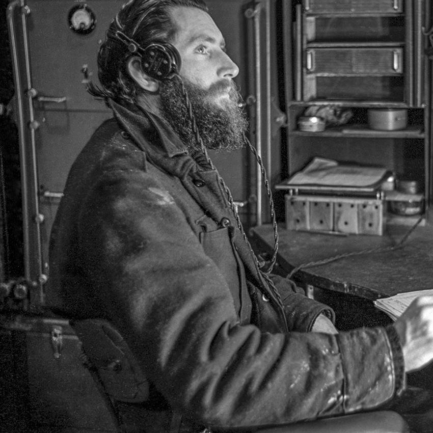 1951 Heard Island, Radio Operator working the morse key © R. Dingle/AAD